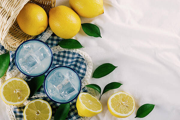https://render.fineartamerica.com/images/images-profile-flow/400/images/artworkimages/mediumlarge/2/top-view-of-lemon-juice-glasses-on-a-white-tablecloth-at-a-picnic-cavan-images.jpg