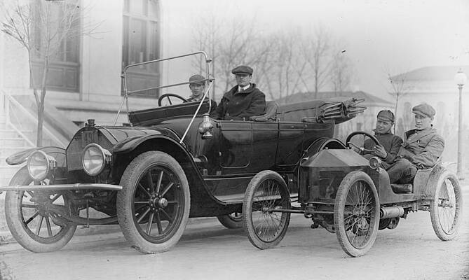 Wall Art - Painting - Two men in automobiles; i.e. two in a large car and two in a miniature vehicle by