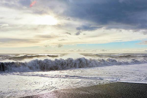 Wall Art - Photograph - View Of Waves Splashing On Shore Against Cloudy Sky by Cavan Images