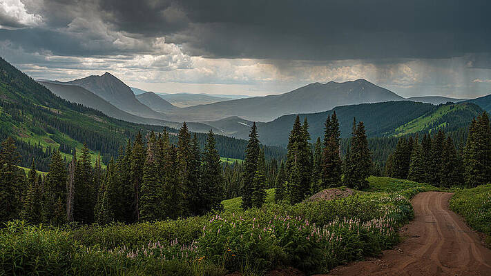Mountain Road Under Stormy Sky Wall Art