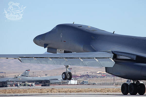 Wall Art - Photograph - Ellsworth based B-1B Lancer 86-0111 launching from 03R Nellis AFB #1 by Custom Aviation Art