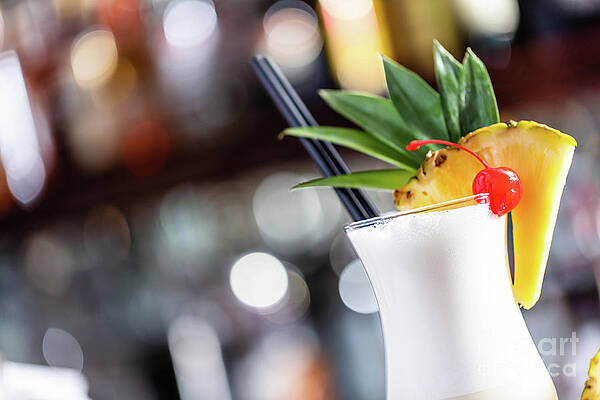 Pina colada coctail on bar counter by Michal Bednarek Pina colada coctail on bar counter by Michal Bednarek
