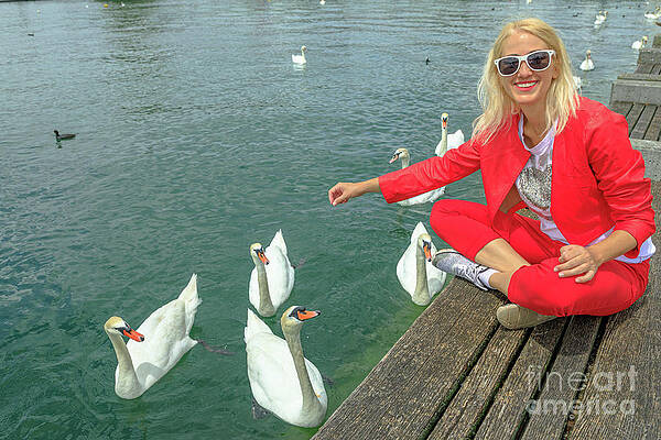 Woman with swans in Zurich lake by Benny Marty Woman with swans in Zurich lake by Benny Marty