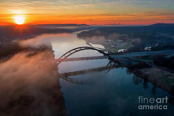 Aerial view as clouds cover the 360 Pennybacker Bridge during sunrisePennybacker Bridge as during by Herronstock Prints Aerial view as clouds cover the 360 Pennybacker Bridge during sunrisePennybacker Bridge as during by Herronstock Prints
