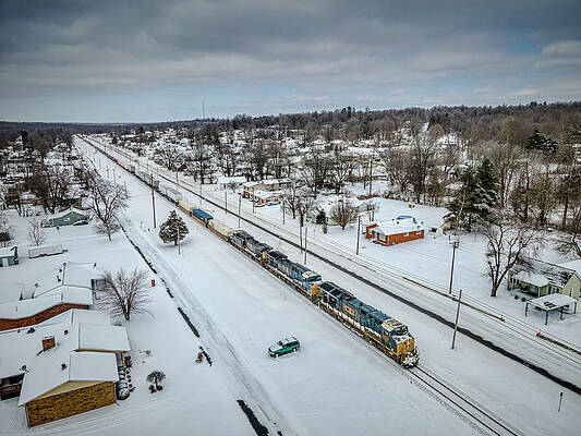 An almost empty CSX Q025 southbound through the snow by Jim Pearson An almost empty CSX Q025 southbound through the snow by Jim Pearson