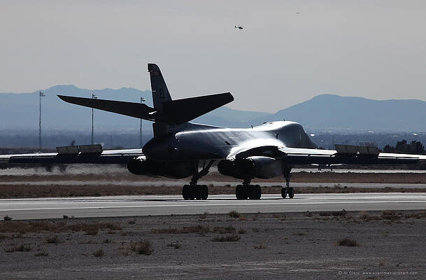 Wall Art - Photograph - B-1B Lancer rolling out on Rwy 21L at Nellis AFB by Custom Aviation Art