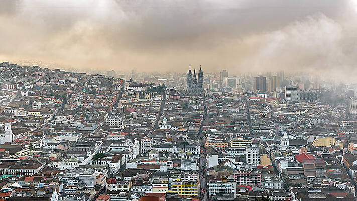 Wall Art - Photograph - Bird's eye view of old colonial town of Quito at dawn on a cloudy day by Henri Leduc