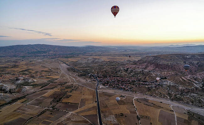 Wall Art - Photograph - Cappadocia, Turkey - Wide angle Panorama aerial shot of colorful hot air balloons together floating  by Arpan Bhatia