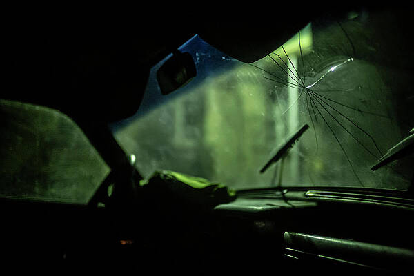Wall Art - Photograph - Cracked windshield of an abandoned Volga in the streets of Gyumr by Ruben Vicente