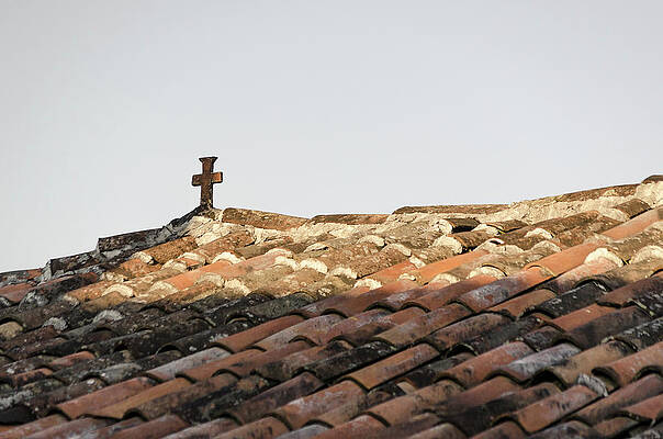 Cross On The Roof Of A House by Jonathan Lopez