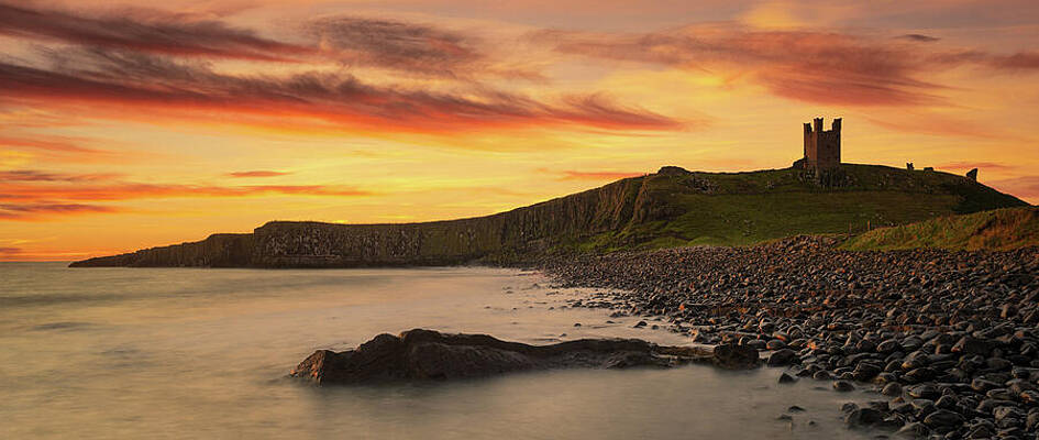 Dunstanburgh Castle Sunrise by Dave Bowman Dunstanburgh Castle Sunrise by Dave Bowman