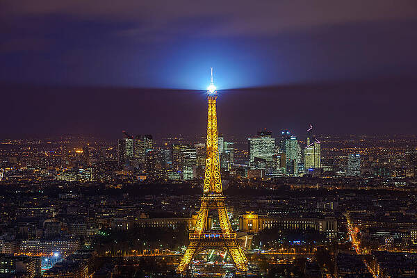Eiffel Tower in Paris seen at night. by George Afostovremea Eiffel Tower in Paris seen at night. by George Afostovremea