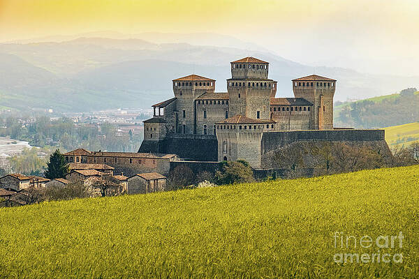 landmarks of italy, the Torrechiara fantasy castle near Parma - Italy with yellow warm toned grass a by Luca Lorenzelli landmarks of italy, the Torrechiara fantasy castle near Parma - Italy with yellow warm toned grass a by Luca Lorenzelli