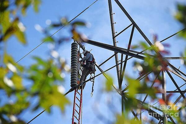 Wall Art featuring the photograph Lineman At Work On Tower by Addison Likins