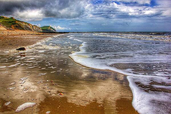 Lonely beach at Charmouth Dorset, Uk by Chris Clark Lonely beach at Charmouth Dorset, Uk by Chris Clark