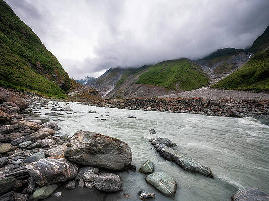 Low angle perspective view from the Waiho River Valley in New Ze by Daniela Constantinescu Low angle perspective view from the Waiho River Valley in New Ze by Daniela Constantinescu