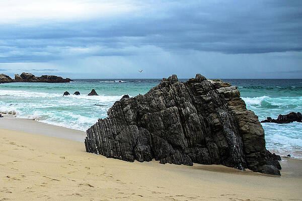 Wall Art featuring the photograph Moody Beach Sky With Rock by Matthew DeGrushe