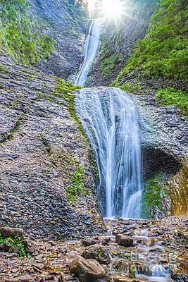 Mountain stream and waterfall on rocks by Cosmin-Constantin Sava