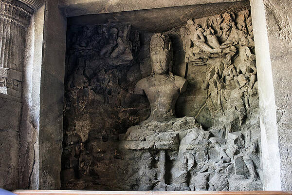 Wall Art - Photograph - Mumbai, India - An interior of UNESCO certified Elephanta cave with god sculpture carved on a wall in 5th century. Ancient Indian art and culture by Arpan Bhatia