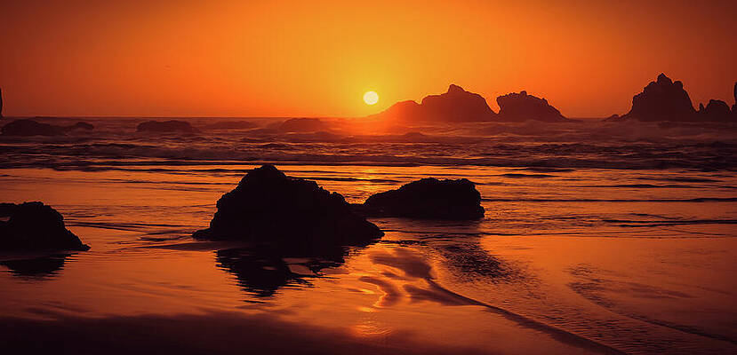 Sunset Over Rocky Shoreline Photograph