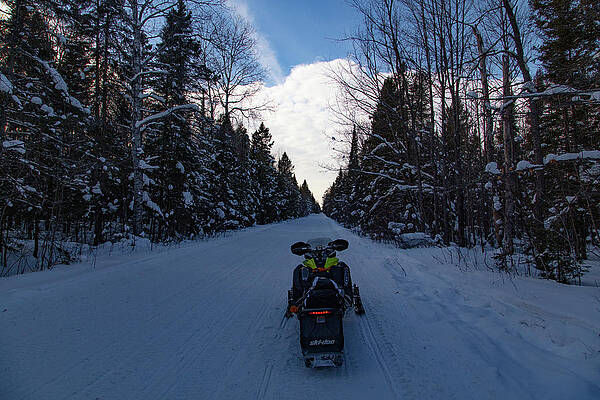 Wall Art - Photograph - Snowmobile on trail of Lake of the Clouds in Michigan winter by Eldon McGraw