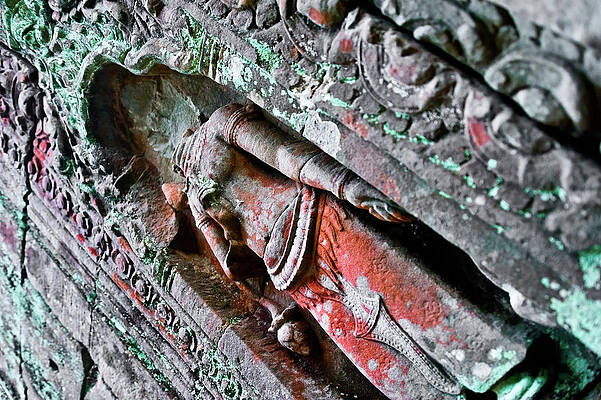 Statue carved on Angkor temple walls. Cambodia by Lie Yim Statue carved on Angkor temple walls. Cambodia by Lie Yim