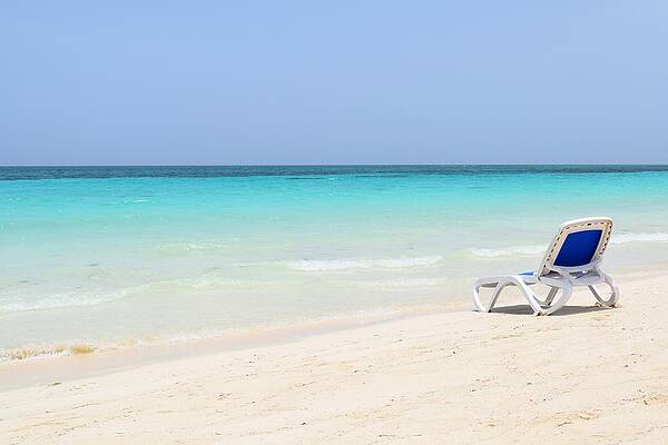 Wall Art - Photograph - The lonely chair on beach Photo 205 by Lucie Dumas