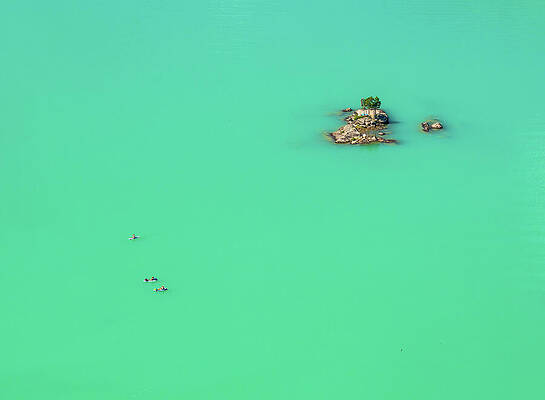 Kayakers Near Small Island Photograph