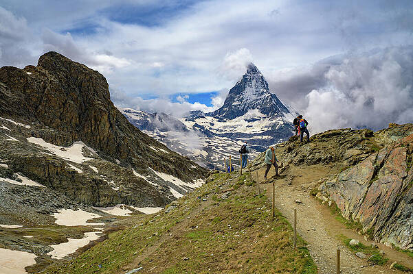 Wall Art - Photograph - Tourists Hiking Near Snow-Covered Matterhorn in Swiss Alps by Miroslav Liska