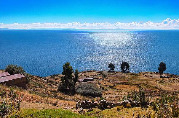 Nature Wall Art featuring the photograph Tranquil Lakeside Beauty At Lake Titicaca by Travel Essayist
