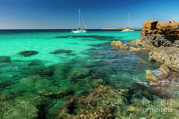 Two sailboats and rocky coast by Vicente Sargues Two sailboats and rocky coast by Vicente Sargues