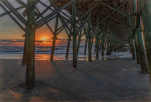Under the Pier, Folly Beach Sunrise by Marcy Wielfaert Under the Pier, Folly Beach Sunrise by Marcy Wielfaert