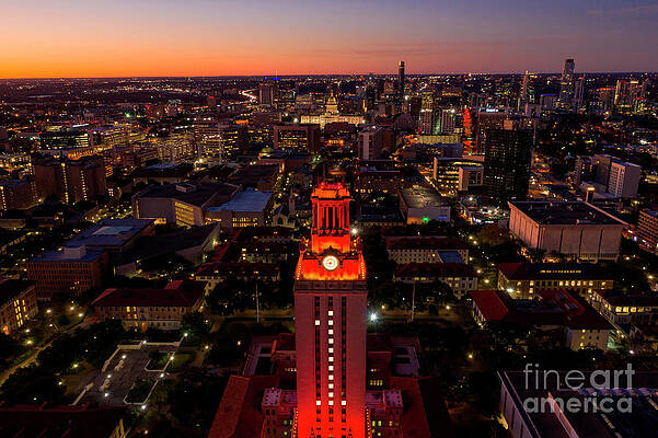 University of Texas Tower lit with No. 1 shines bright Orange over the Austin skyline and Capitol by Herronstock Prints University of Texas Tower lit with No. 1 shines bright Orange over the Austin skyline and Capitol by Herronstock Prints