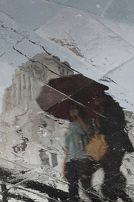Walking In The Rain Protected With An Umbrella by Jonathan Lopez