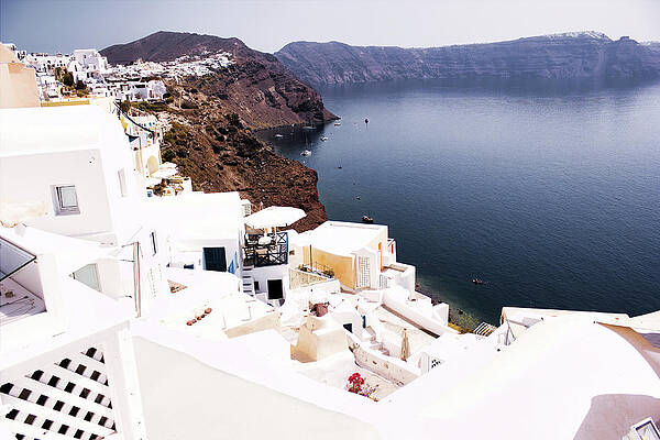 Wall Art - Photograph - Wide angle view of White washed houses and buildings on volcanic mountain cliff Firostefani, Santorini, Cyclades, Greek Island travel Santorini Greece architecture by Arpan Bhatia