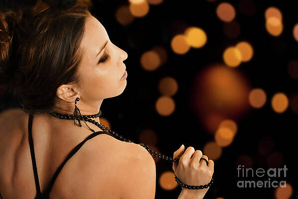 Woman in front of bokeh lights by Jelena Jovanovic Woman in front of bokeh lights by Jelena Jovanovic