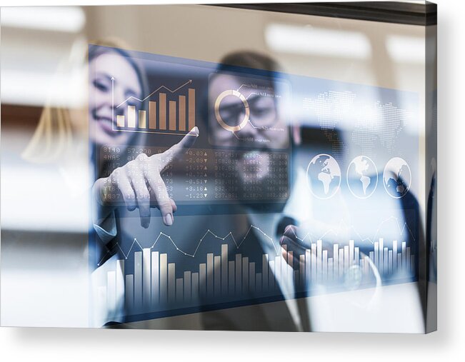 Financial Figures Acrylic Print featuring the photograph Busines couple discussing business profit on a modern interface #1 by Guvendemir