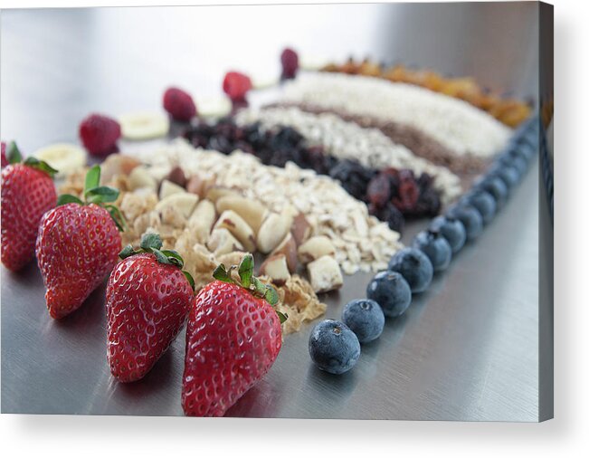 In A Row Acrylic Print featuring the photograph Raw Nuts, Fruit And Grains #1 by Laurie Castelli