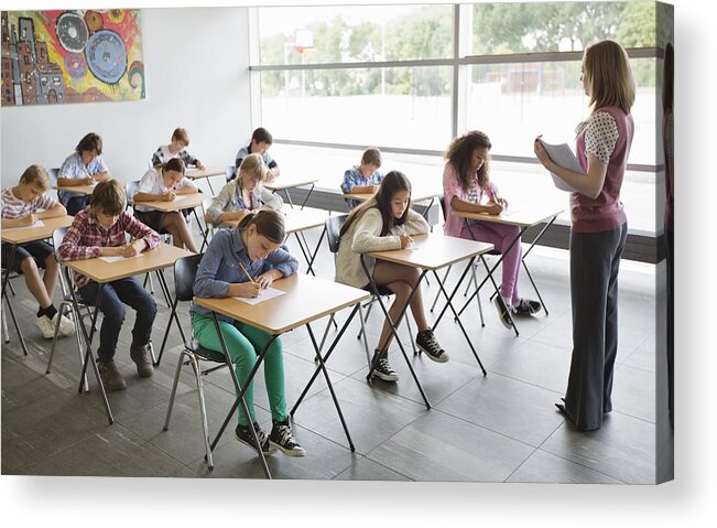 Education Acrylic Print featuring the photograph Students taking a test in classroom #1 by Compassionate Eye Foundation/Robert Daly/OJO Images