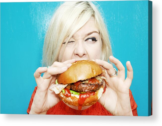 Unhealthy Eating Acrylic Print featuring the photograph Woman Eating Hamburger #1 by Tara Moore