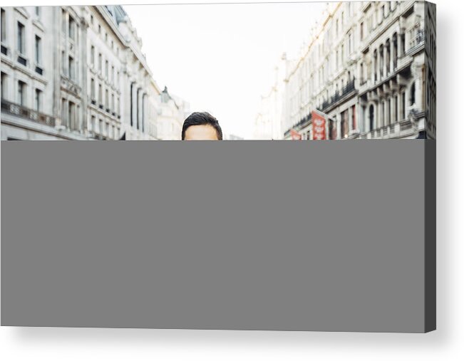 Young Men Acrylic Print featuring the photograph Young happy smiling man in glasses on the streets of London, UK #1 by Alexander Spatari