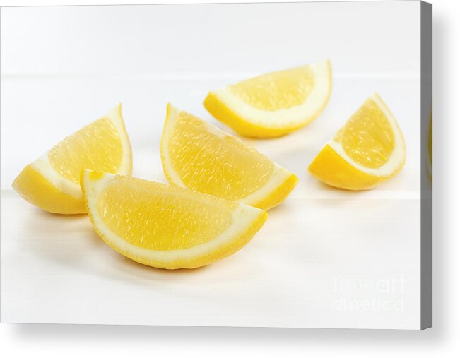 Lemon Acrylic Print featuring the photograph Lemon Wedges on White Background #2 by Colin and Linda McKie