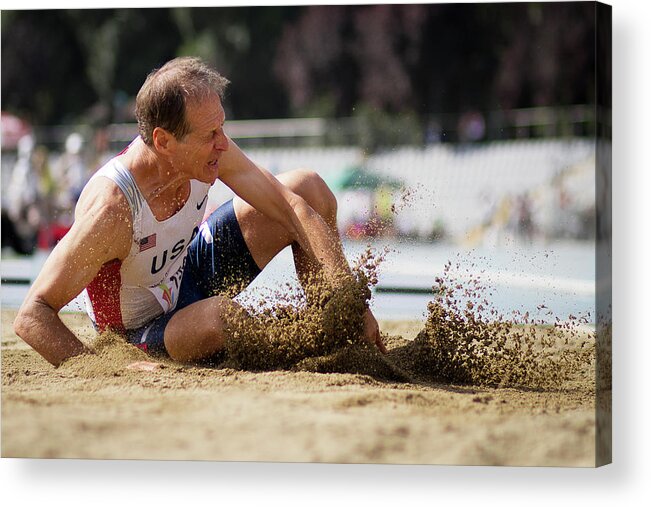 One Person Acrylic Print featuring the photograph American Senior Competes In Long Jump by Alex Rotas
