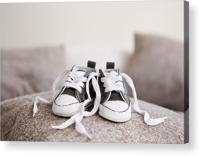 Braunschweig Acrylic Print featuring the photograph Baby shoes on pillow by Nils Hendrik Mueller