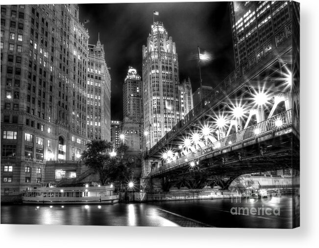Modern; City; Cityscape; Road; Bridge; Outdoor; Outside; Perspective; Street; Transportation; Building; Chicago; Illinois; Downtown; Urban; United States; Lights; Road; Street; Michigan Avenue; Dusable Bridge; Sidewalk; Walkway; Lights; Boat; Night; Nighttime; Dark; Usa; Tribune Tower; River; Chicago River; Black And White; Monochrome Acrylic Print featuring the photograph Boat Along the Chicago River by Margie Hurwich