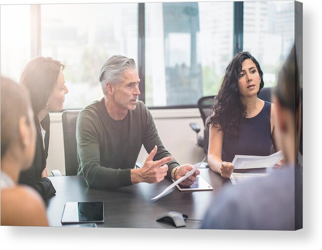 Working Acrylic Print featuring the photograph Business people on a meeting at the office by Xavierarnau