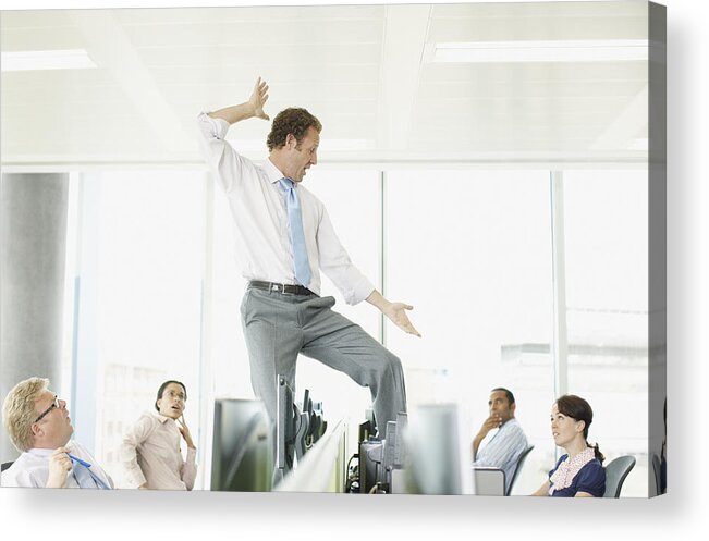 People Acrylic Print featuring the photograph Businessman dancing on desk in cubicle by Paul Bradbury