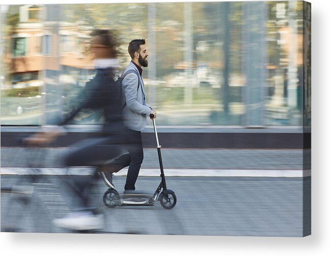 Hipster Acrylic Print featuring the photograph Businessman riding scooter along office building by Westend61