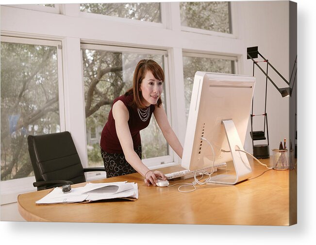 Working Acrylic Print featuring the photograph Businesswoman working at desktop computer by Comstock