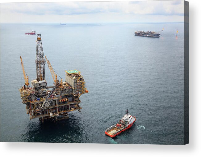 Oil Rig Supply Ship Acrylic Print featuring the photograph Busy Oil Field by Heliry